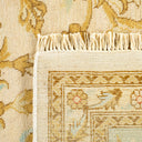 Close-up of a high-quality, traditional rug with intricate floral patterns