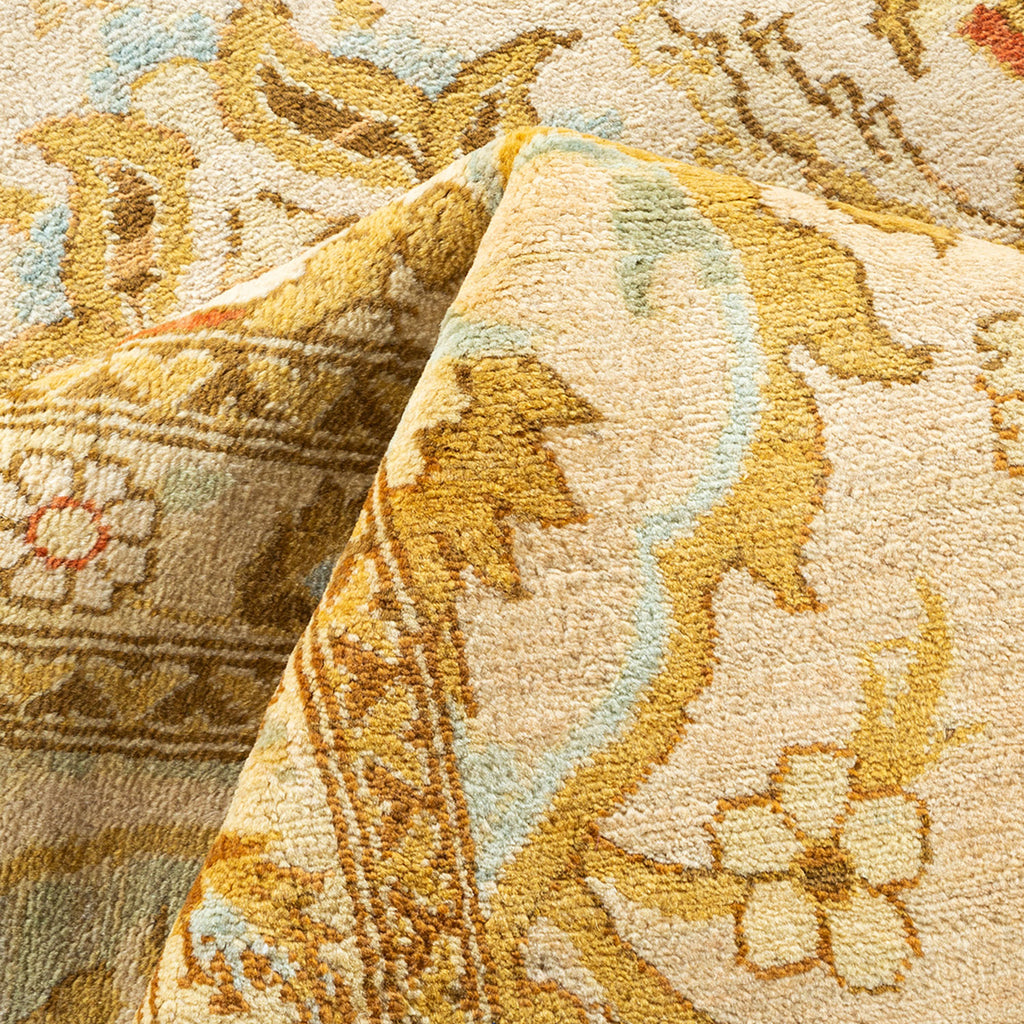 Intricate floral patterned carpet with warm tones and plush texture.