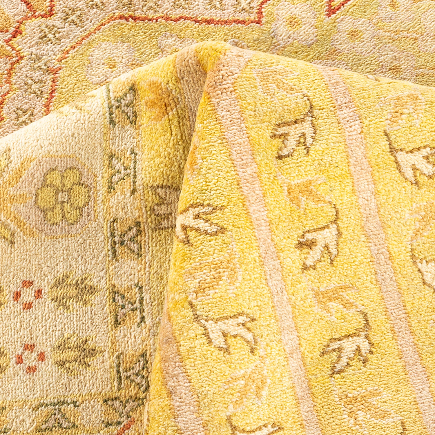 Close-up view of a folded, patterned textile with floral motifs.