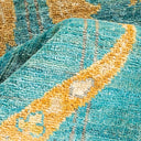 Close-up of vibrant, textured fabric with geometric and abstract patterns.