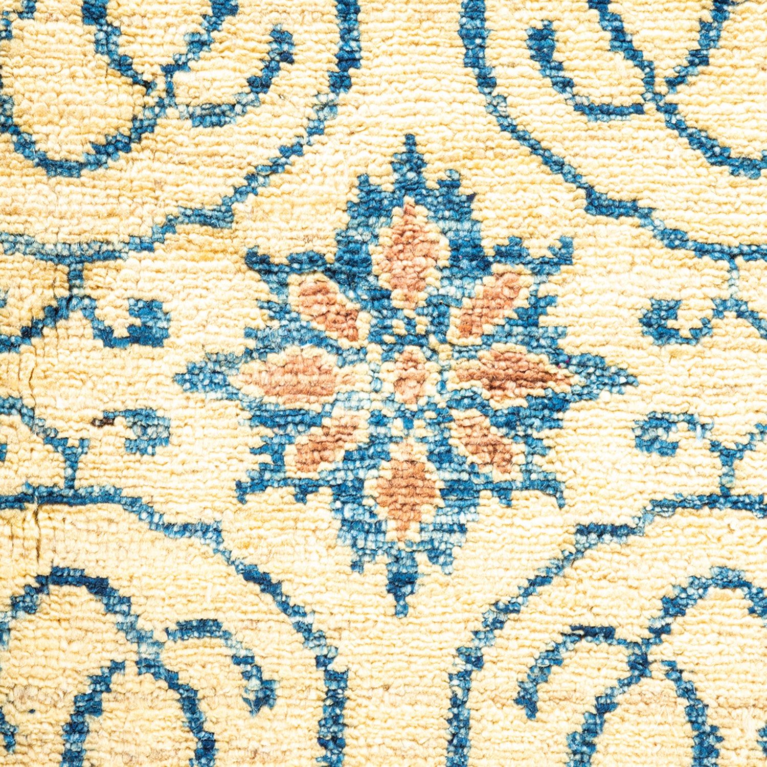 Close-up view of a plush, nubby textile with symmetrical floral pattern.