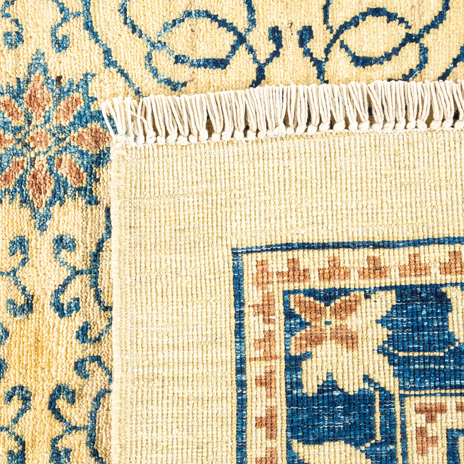 Close-up of a intricately woven Oriental rug with ornamental designs.