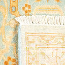 Close-up of a vibrant, hand-woven rug with intricate design details.