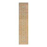 Runner rug with ornate design and geometric shapes in blue.