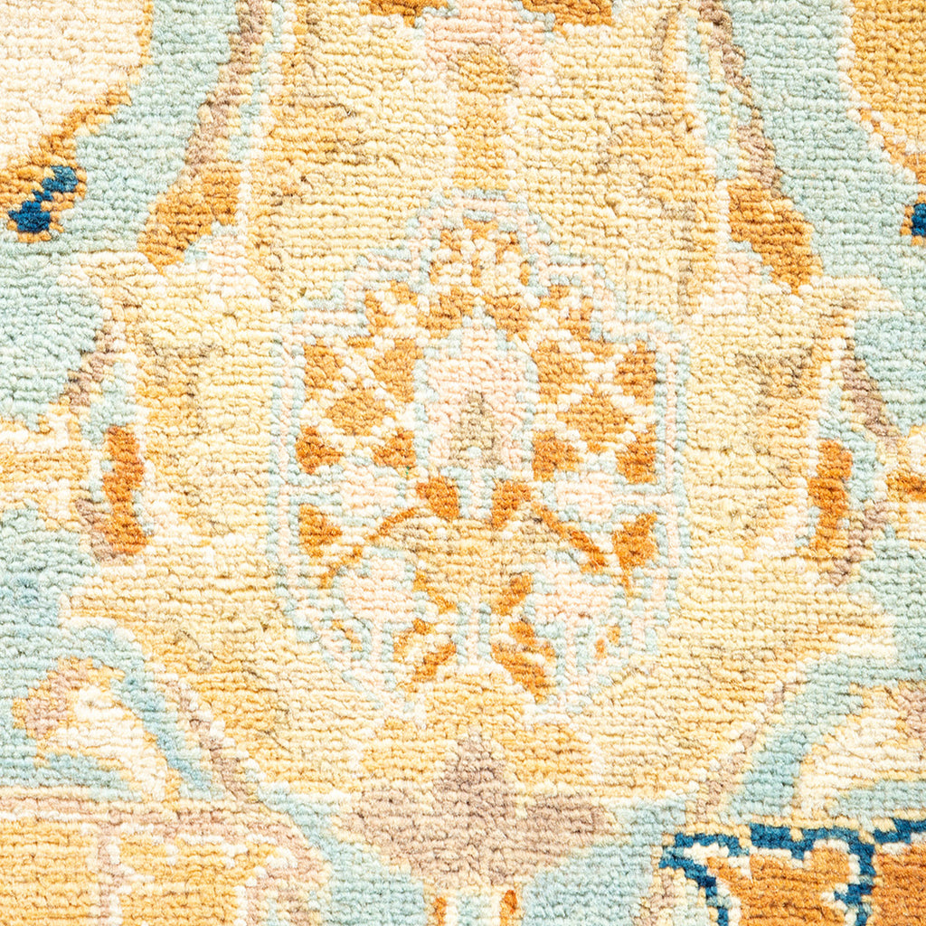 Close-up view of a detailed, symmetrical woven fabric or carpet.