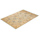 Intricately designed rectangular rug with traditional Oriental motifs and colors.