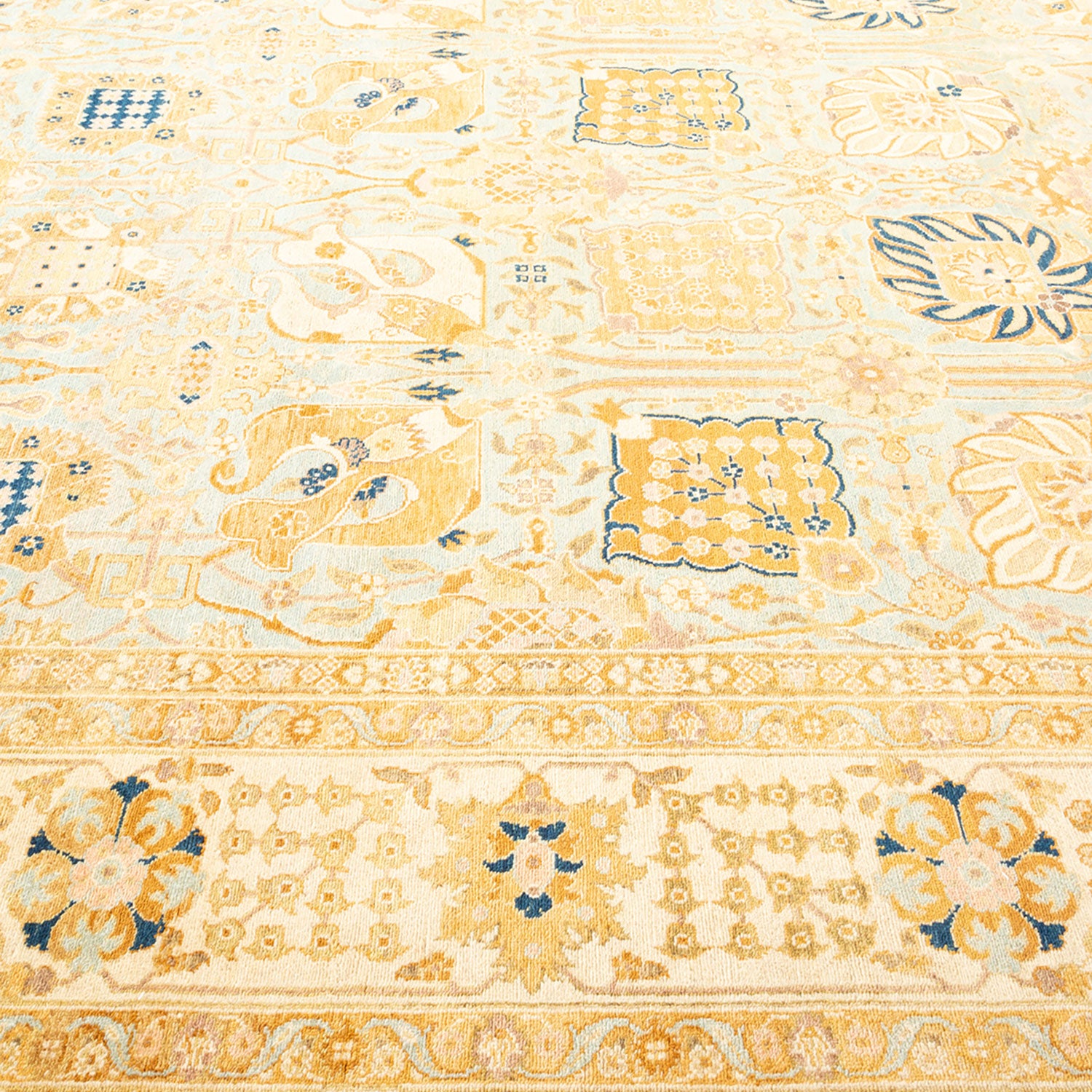 Intricate and ornate traditional rug displays symmetrical floral and geometric motifs.
