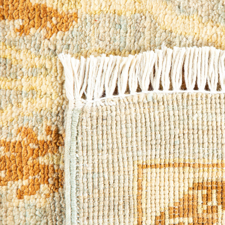 Close-up view of a plush carpet with intricate textured design.