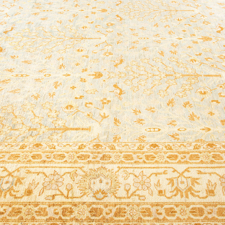 Close-up of a vintage rug with intricate floral and vegetal motifs.