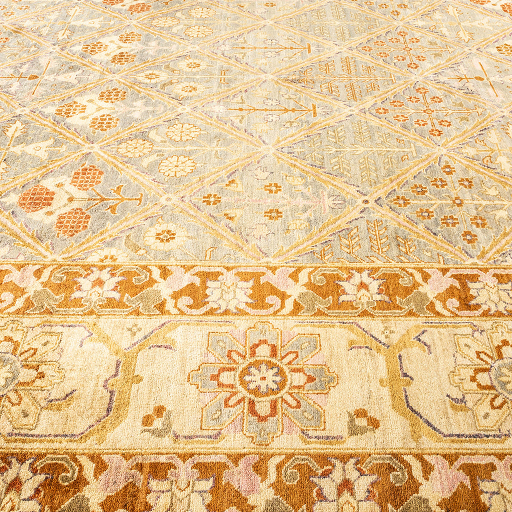 Close-up of an ornate, symmetrical carpet with intricate floral motifs.
