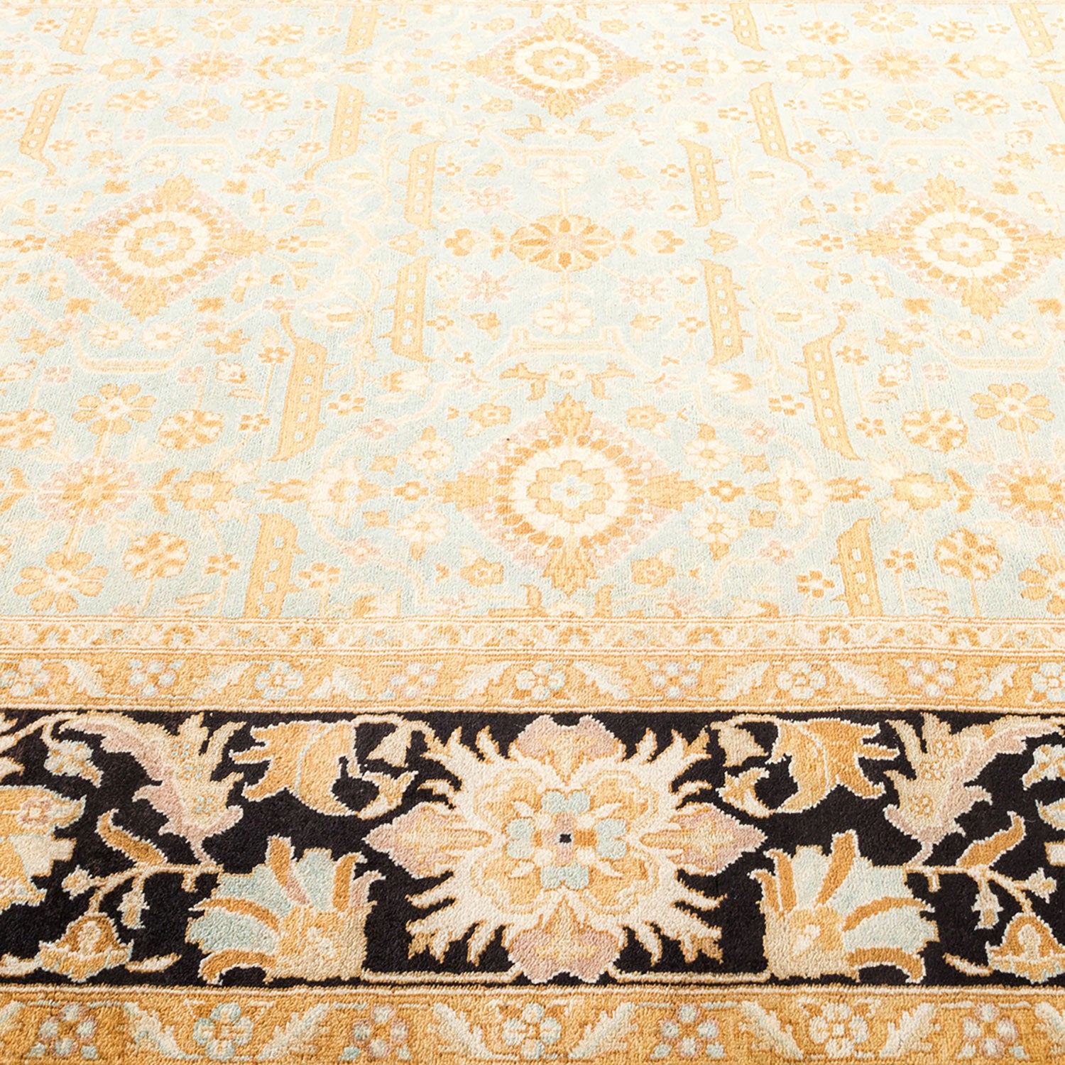 An intricate, traditional-style ornate carpet with floral and geometric motifs.
