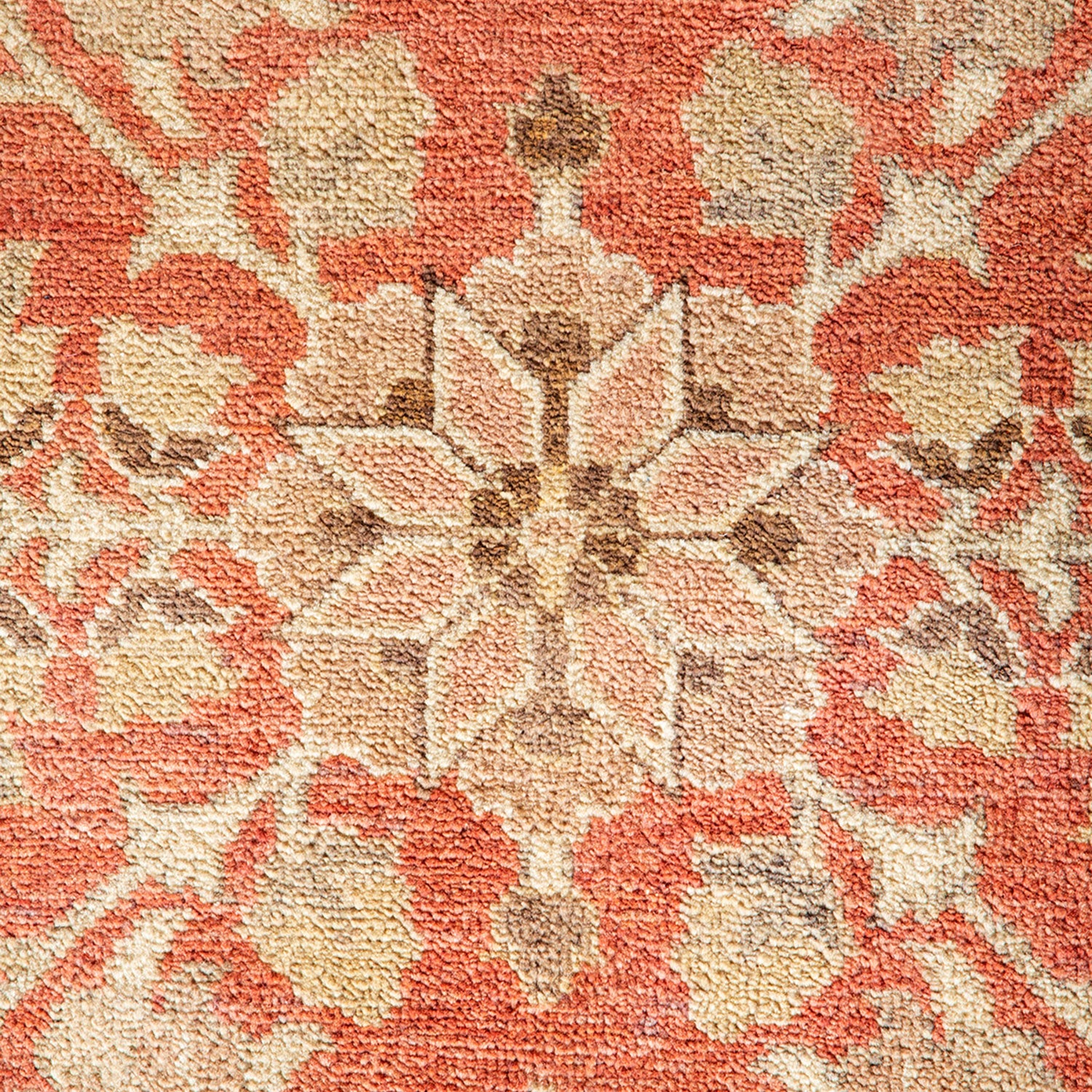 Close-up of an ornate textile with a traditional floral pattern