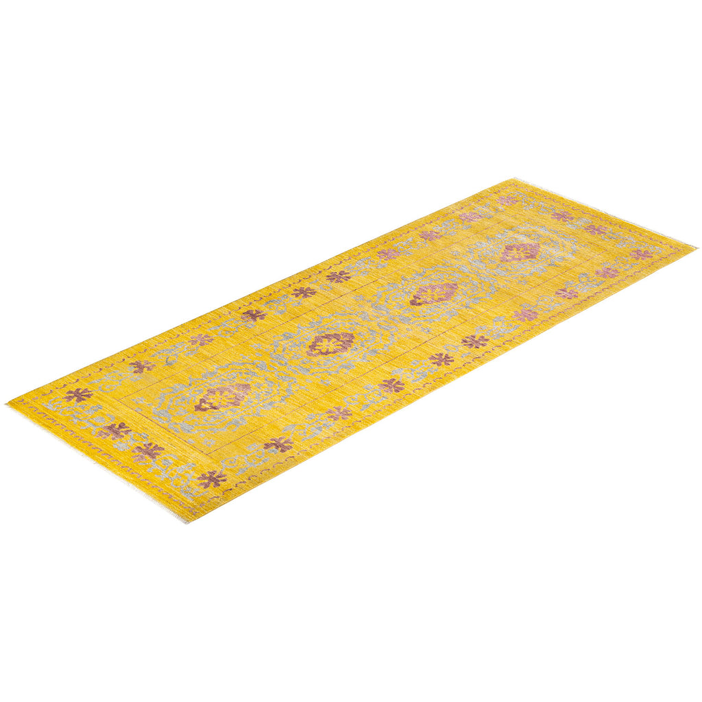 Vintage-inspired yellow area rug with intricate floral and geometric patterns.