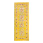 Vibrant yellow and purple runner rug with intricate symmetrical patterns
