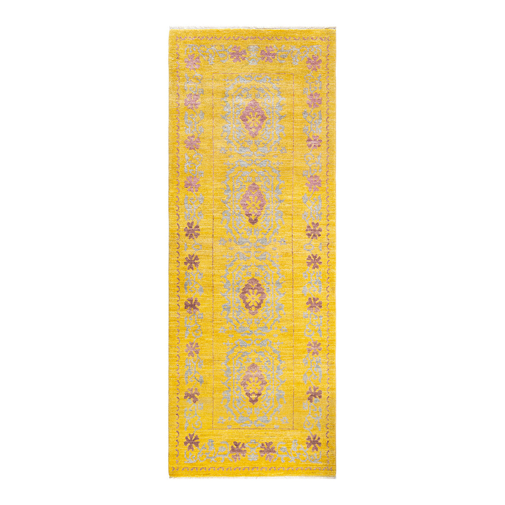 Vibrant yellow and purple runner rug with intricate symmetrical patterns