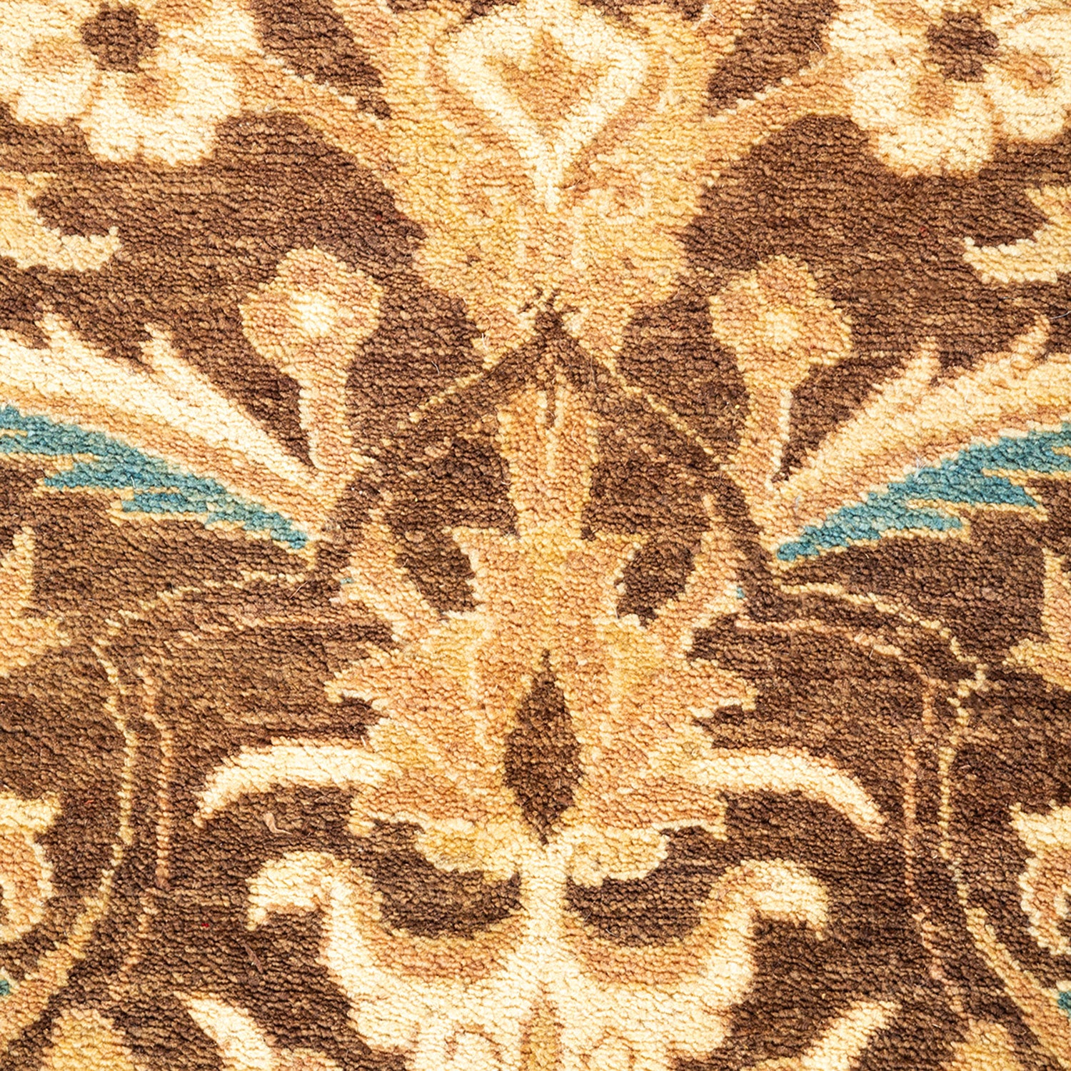 Close-up of an elegant, symmetrical patterned carpet with intricate details