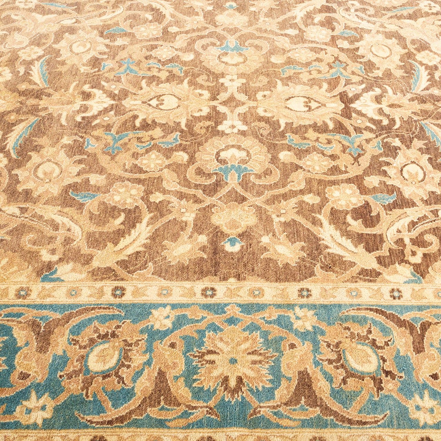 Symmetrical and intricate carpet design with floral motifs and swirls