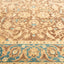 Symmetrical and intricate carpet design with floral motifs and swirls