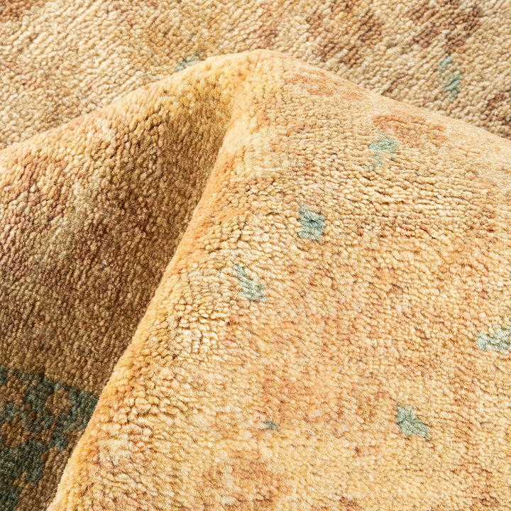 Close-up of a luxurious golden carpet with textured pile