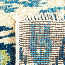 Close-up of handcrafted woolen fabric displaying textured blue pattern.