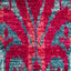 Vibrant textile with intricate symmetrical patterns in red and blue.