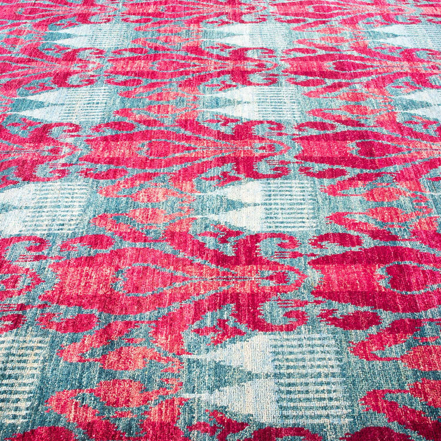 Vibrant vintage rug with ornate pattern adds bold character