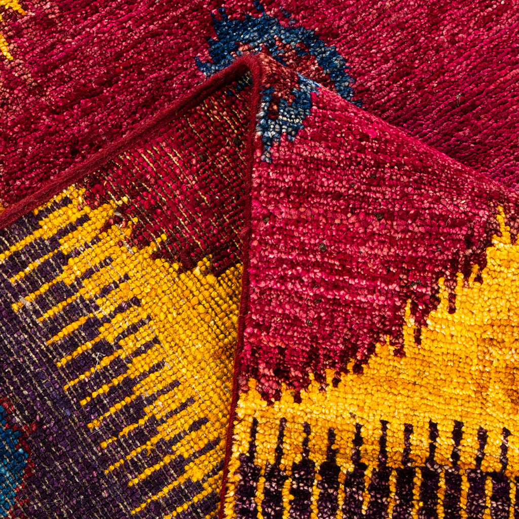 Vibrant textile showcases intricate weaving patterns and rich color palette.
