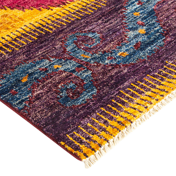 Vibrant and ornamental area rug with bold colors and intricate design.