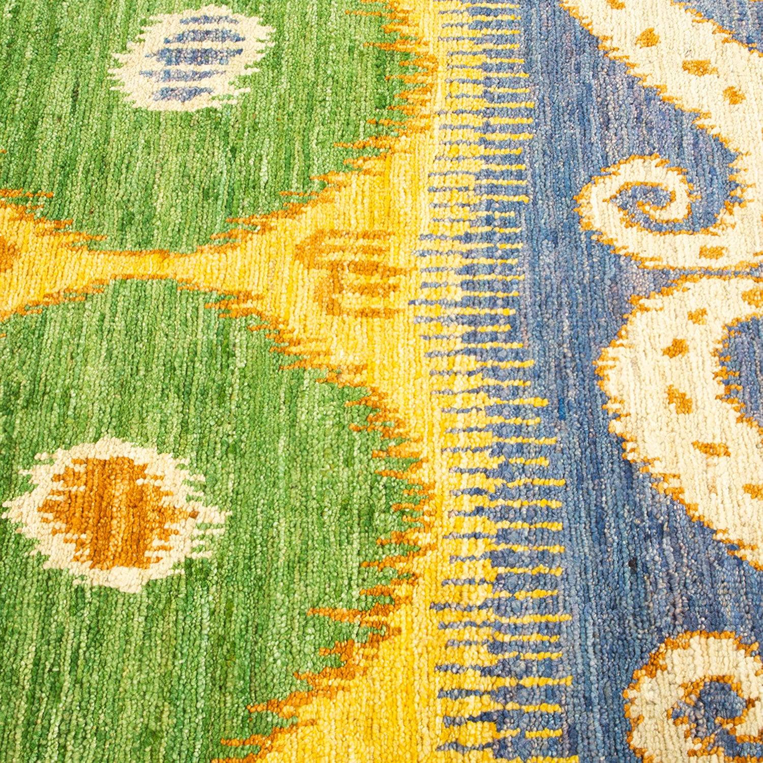Close-up view of a vibrant, intricately designed floral patterned carpet.