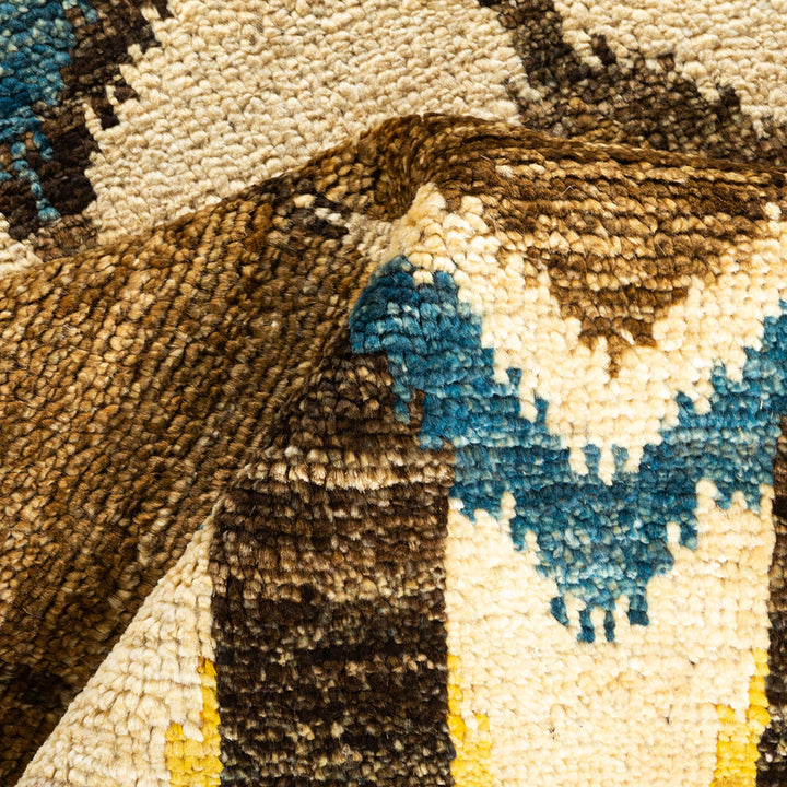 Close-up of a colorful, symmetrical textile with intricate geometric pattern.