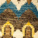 Close-up of a textured textile with geometric patterns in earthy colors