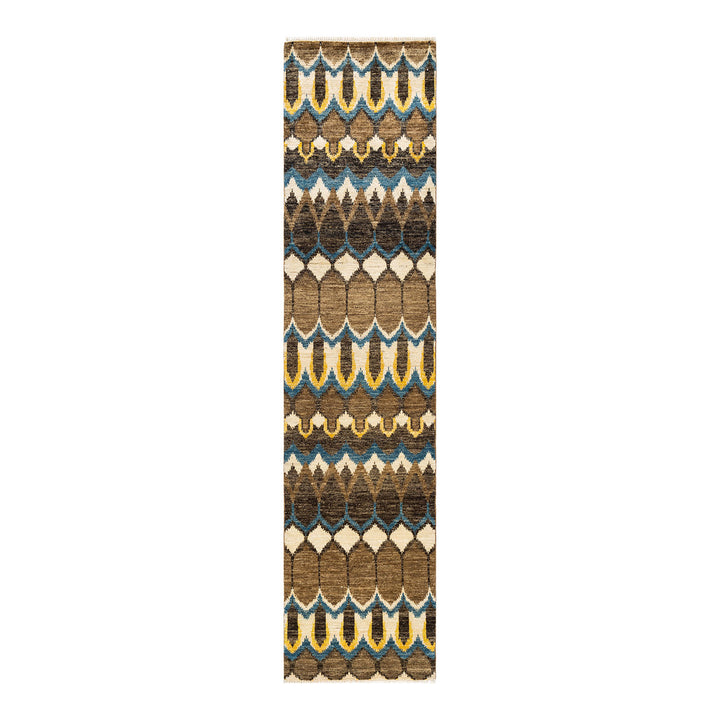 Symmetrical tribal runner with stylized leaf pattern in earth tones.