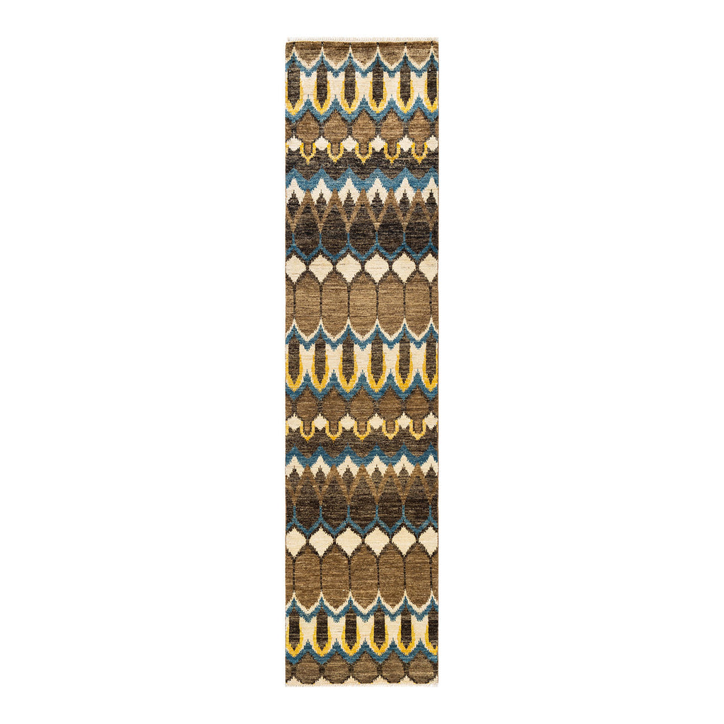 Symmetrical tribal runner with stylized leaf pattern in earth tones.