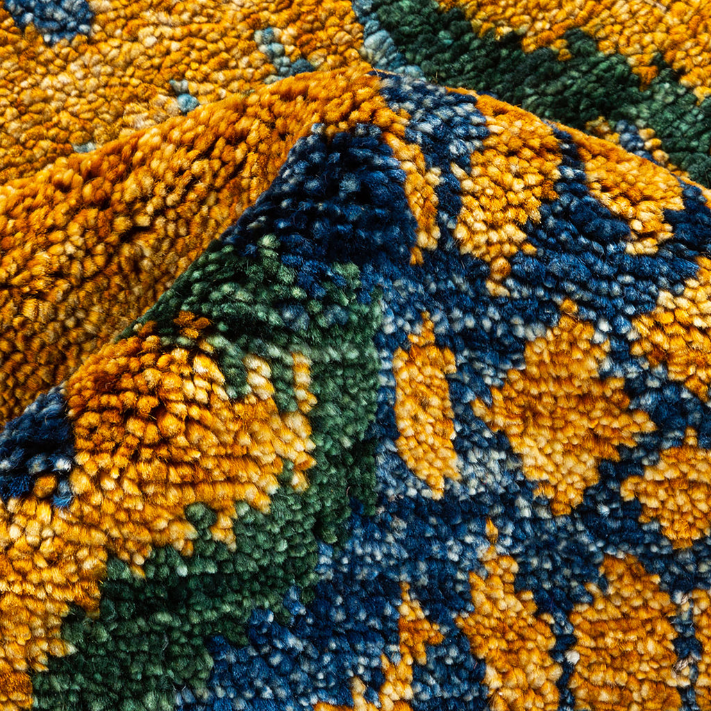 Vibrant and textured fabric showcases rich colors in close-up shot.