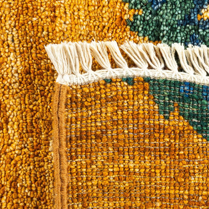 Intricate weave of warm colored rug highlights craftsmanship and texture.