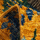 Close-up of a plush, geometric woven rug with vibrant colors.