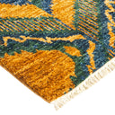 Close-up view of a vibrant, geometric rug with plush pile.