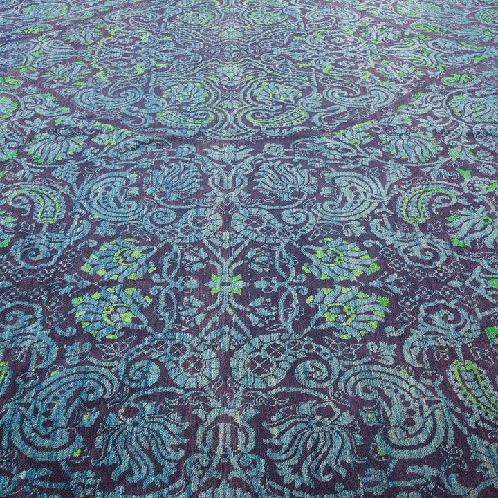 Exquisite and symmetrical patterned carpet in navy with botanical accents