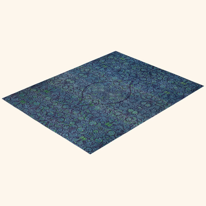An ornate paisley rug in shades of blue and green.