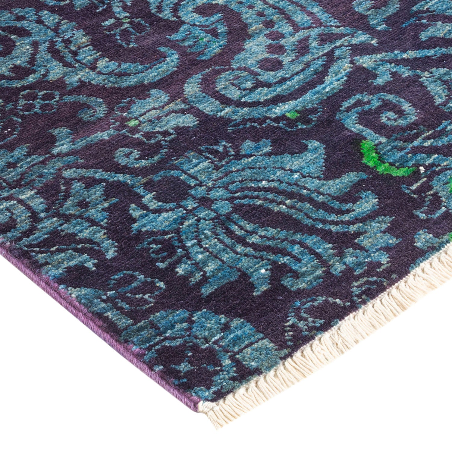 Close-up of a plush, deep purple carpet with intricate detailing.