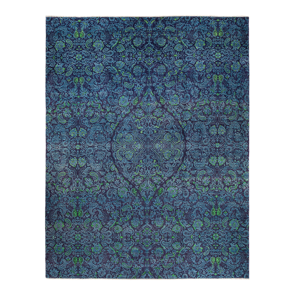 Intricate, symmetrical blue pattern resembling fabric designs with green accents.