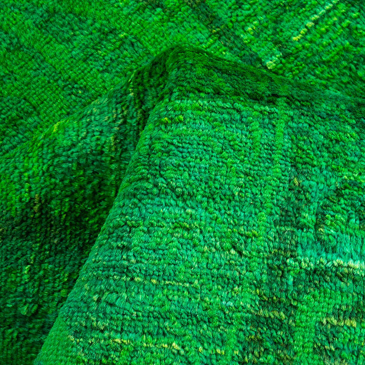 Vibrant green textured fabric with plush, fluffy terrycloth-like appearance.
