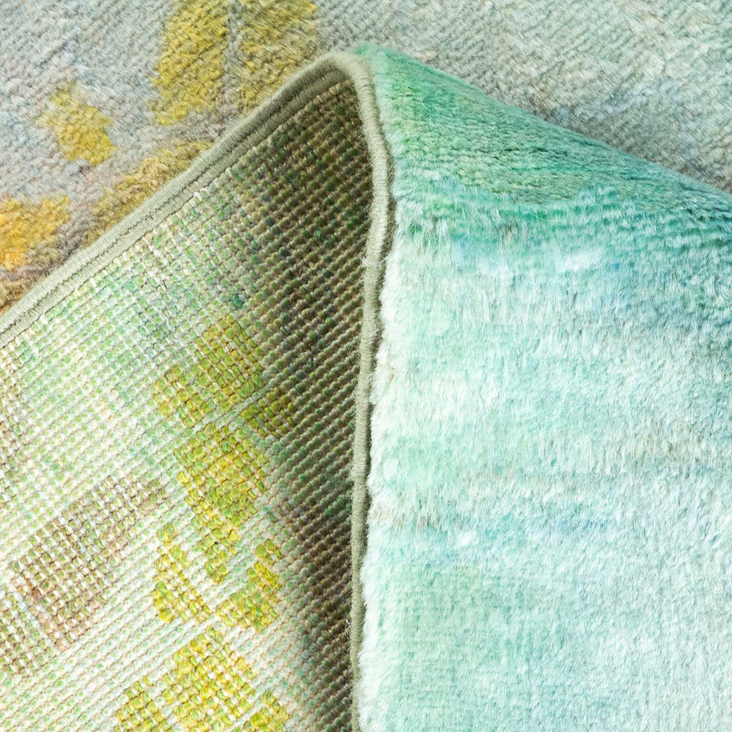 A detailed close-up of a folded fabric with various textures and colors.