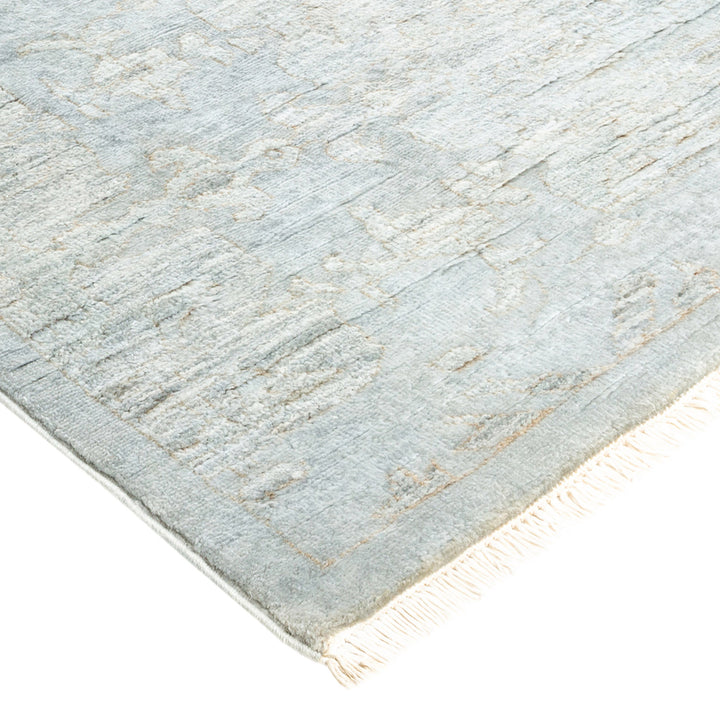 Contemporary distressed rug with soft texture and minimalist fringe detail.