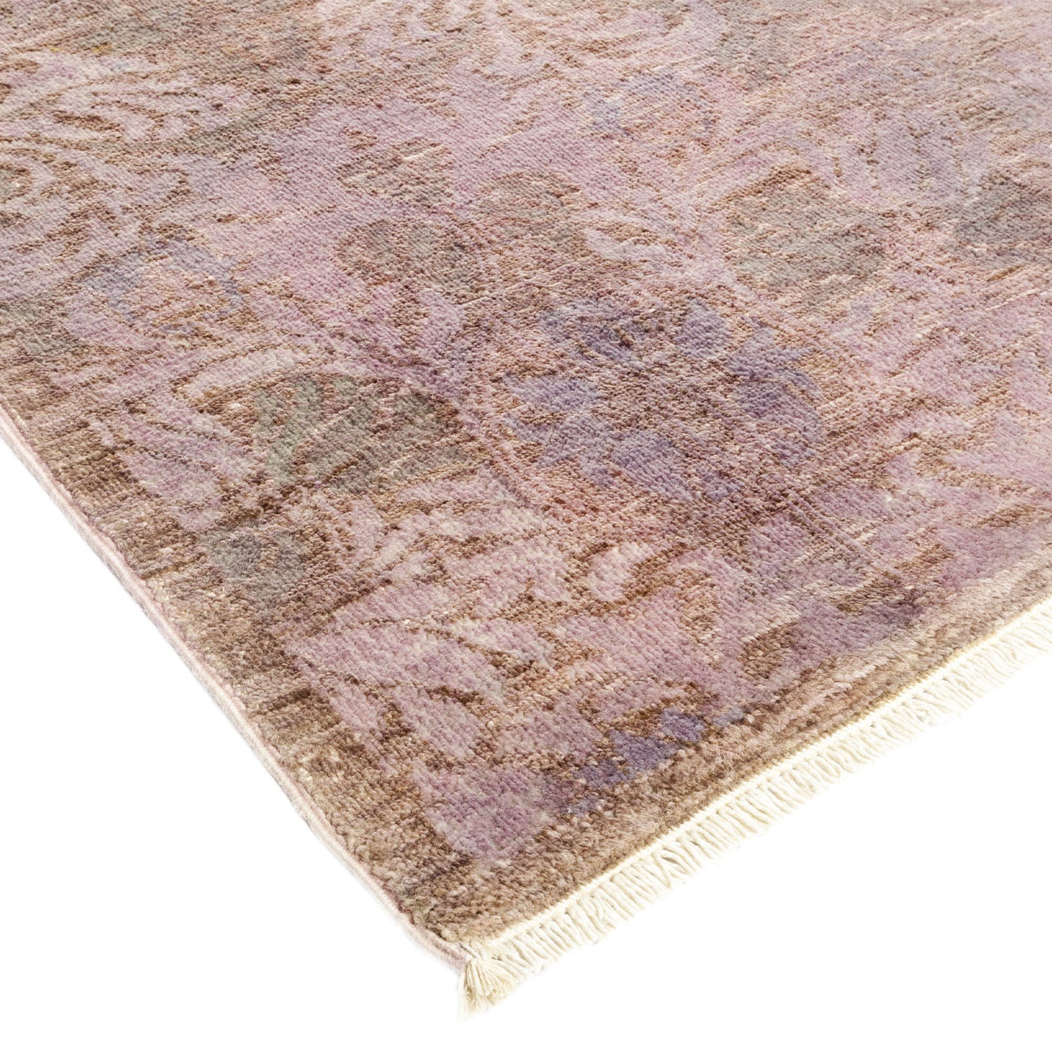Intricate floral patterned rug with muted purple, beige, and blue.