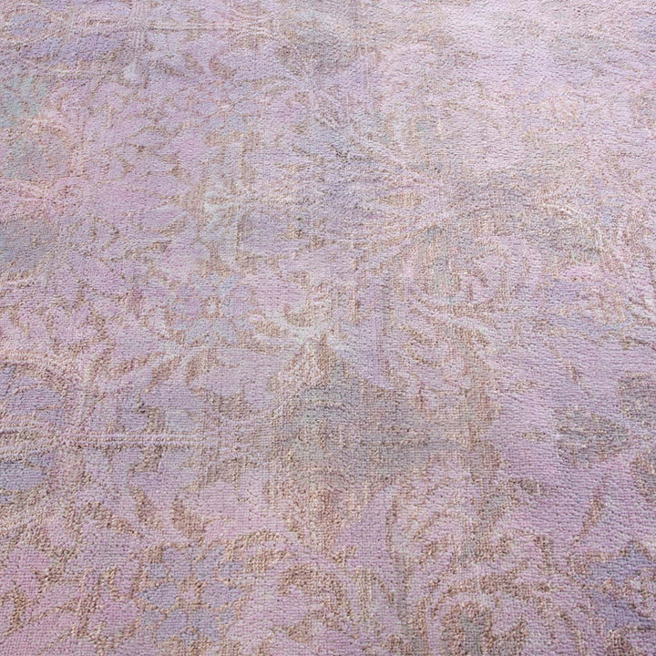 Soft and elegant vintage-style carpet in muted pastel shades.