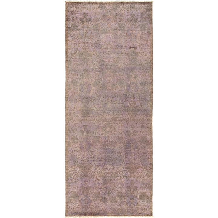 Vintage-inspired rectangular rug with faded pastel hues and intricate pattern.