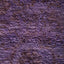 Close-up of a purple textured surface with natural irregularities.