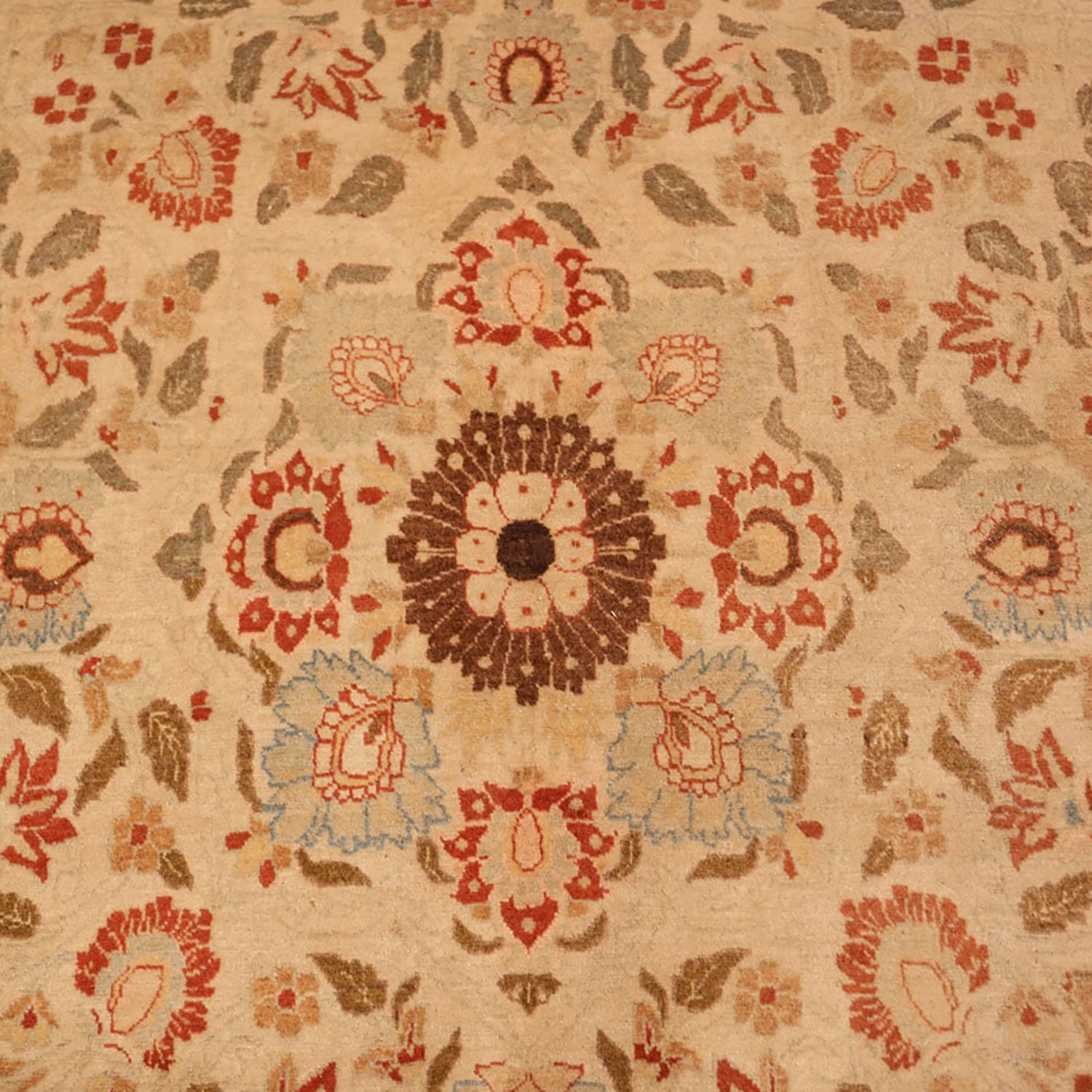 Exquisite traditional carpet with intricate floral designs in warm tones.