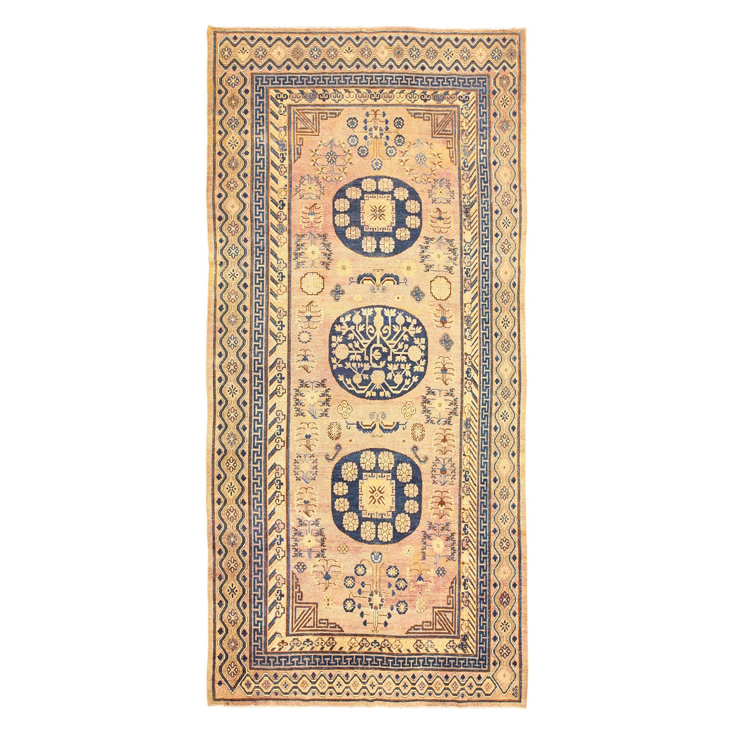 Traditional rectangular area rug with ornate patterns and symmetrical medallions.